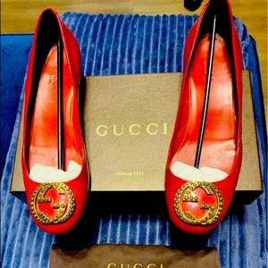 Authentic Gucci Patient Leather Pump with Brass Studded Interlocking GGs.